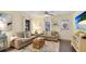 Cozy living room with neutral decor, comfortable seating and beach themed decor at 4721 Garcia Ave, Sarasota, FL 34233