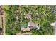 Aerial view of property showcasing lush landscaping, pool, and outdoor areas at 4916 Hidden Oaks Trl, Sarasota, FL 34232
