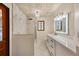 Well-lit bathroom with a walk-in shower, updated vanity, and contemporary fixtures for a luxurious feel at 4916 Hidden Oaks Trl, Sarasota, FL 34232