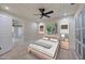Cozy bedroom with wood floors, white shiplap ceiling, and sliding doors at 4916 Hidden Oaks Trl, Sarasota, FL 34232