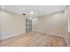 Bright, spacious bedroom with hardwood floors and a unique textured ceiling at 4916 Hidden Oaks Trl, Sarasota, FL 34232