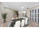Elegant dining room featuring contemporary décor and a stylish ceiling fan at 4916 Hidden Oaks Trl, Sarasota, FL 34232