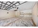 Clean two-car garage with custom flooring, built-in cabinets, and a designated laundry area at 4916 Hidden Oaks Trl, Sarasota, FL 34232