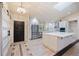 Bright, updated kitchen features white cabinetry, stainless steel appliances, and a large center island at 4916 Hidden Oaks Trl, Sarasota, FL 34232