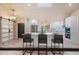 Stylishly appointed kitchen with an island, stainless steel appliances, and seating at 4916 Hidden Oaks Trl, Sarasota, FL 34232