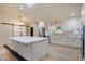 Bright, updated kitchen with white cabinets, stainless steel appliances, and a large center island at 4916 Hidden Oaks Trl, Sarasota, FL 34232