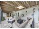 Relaxing outdoor living space with comfortable seating and a built-in grill, perfect for entertaining at 4916 Hidden Oaks Trl, Sarasota, FL 34232