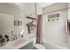 Bright bathroom featuring a tub/shower combo and modern vanity at 5023 Brickell Park Cv, Bradenton, FL 34211