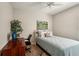 Cozy bedroom with desk, chair, and a comfortable bed at 5023 Brickell Park Cv, Bradenton, FL 34211