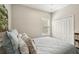 Serene bedroom with shuttered window and a closet at 5023 Brickell Park Cv, Bradenton, FL 34211