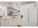 Eat-in kitchen showcasing white cabinets and stainless steel appliances, offering a modern design at 5023 Brickell Park Cv, Bradenton, FL 34211