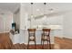 Bright, modern kitchen with white cabinetry, stainless steel appliances, and breakfast bar seating at 5023 Brickell Park Cv, Bradenton, FL 34211