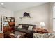 Inviting living room boasts a comfortable sofa, tasteful decor, and hardwood flooring for a welcoming ambiance at 5023 Brickell Park Cv, Bradenton, FL 34211