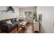 Cozy living room features plush sofa, stylish decor, and ample natural light, creating a comfortable and inviting space at 5023 Brickell Park Cv, Bradenton, FL 34211