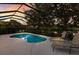 Beautiful pool with screen enclosure and outdoor furniture, perfect for relaxing and entertaining by the water at 5023 Brickell Park Cv, Bradenton, FL 34211