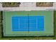 Aerial view of a blue and green tennis court surrounded by landscaped greenery and sidewalks at 5023 Brickell Park Cv, Bradenton, FL 34211