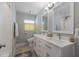 Bright bathroom featuring double vanity, decorative mirror and step-in shower at 508 70Th St, Holmes Beach, FL 34217