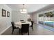 A dining room area with a slider to the outside and modern decor at 508 70Th St, Holmes Beach, FL 34217