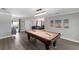 Bright game room with a pool table and access to other living spaces at 508 70Th St, Holmes Beach, FL 34217