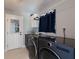 A laundry room with modern washer and dryer units at 508 70Th St, Holmes Beach, FL 34217