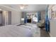A bedroom with a comfortable bench and a sliding door to the pool at 508 70Th St, Holmes Beach, FL 34217