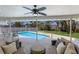 Outdoor living space with comfortable seating overlooking the swimming pool at 508 70Th St, Holmes Beach, FL 34217