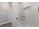 Updated shower features tiled backsplash, grab bar and inset storage at 508 70Th St, Holmes Beach, FL 34217
