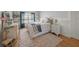 Comfortable bedroom with hardwood floors, beadboard trim, and decor at 526 56Th St, Holmes Beach, FL 34217