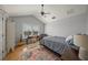 Bedroom with vaulted ceiling, large window, a ceiling fan and hardwood floors at 526 56Th St, Holmes Beach, FL 34217