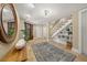 Welcoming foyer featuring tile floors, stylish decor, staircase, and ample natural light at 526 56Th St, Holmes Beach, FL 34217