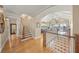 Elegant entryway with hardwood floors, staircase, and views to the open living space at 526 56Th St, Holmes Beach, FL 34217