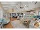 Open concept living and kitchen area with vaulted ceilings, hardwood floors, and stainless steel appliances at 526 56Th St, Holmes Beach, FL 34217