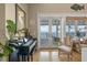 Bright and airy living space featuring a piano and access to an outdoor deck with water views at 526 56Th St, Holmes Beach, FL 34217