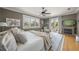 Comfortable main bedroom with hardwood floors, fireplace, balcony and view to tropical landscaping at 526 56Th St, Holmes Beach, FL 34217
