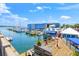 Picturesque marina featuring multiple boats docked near a vibrant blue building and eatery at 526 56Th St, Holmes Beach, FL 34217