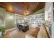 Home office featuring custom built-ins, wood ceiling, and comfortable seating at 526 56Th St, Holmes Beach, FL 34217