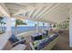 Covered patio with stylish furniture, and panoramic water views, perfect for relaxing and entertaining outdoors at 526 56Th St, Holmes Beach, FL 34217