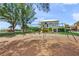 Community playground and play set area with slides and swings near lush landscaping at 526 56Th St, Holmes Beach, FL 34217