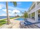 Luxurious pool and spa overlooking the waterfront, featuring lounge chairs for sunbathing and relaxation at 526 56Th St, Holmes Beach, FL 34217