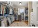 Spacious walk-in closet with custom shelves, drawers, and racks for optimal organization and storage at 526 56Th St, Holmes Beach, FL 34217