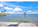 Serene water view with a clear blue sky, showcasing a calm body of water and a visible shoreline at 526 56Th St, Holmes Beach, FL 34217