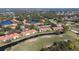 Scenic aerial view of condo buildings next to a golf course at 5630 Golf Pointe Dr # 206, Sarasota, FL 34243
