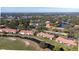 Expansive aerial view of a condo community near a golf course and lake at 5630 Golf Pointe Dr # 206, Sarasota, FL 34243