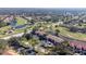 Wide aerial shot of a community with multiple houses, lakes and a golf course at 5630 Golf Pointe Dr # 206, Sarasota, FL 34243