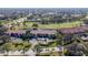 Serene aerial view of a community with lush greenery and a golf course at 5630 Golf Pointe Dr # 206, Sarasota, FL 34243