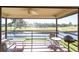Enjoy the scenery from this covered balcony overlooking the waterfront and a golf course at 5630 Golf Pointe Dr # 206, Sarasota, FL 34243