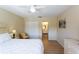 The main bedroom includes closet space, ceiling fan and adjacent bathroom at 5630 Golf Pointe Dr # 206, Sarasota, FL 34243