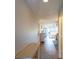 Bright condo hallway with recessed lighting and hardwood floors leading to an inviting living space at 5630 Golf Pointe Dr # 206, Sarasota, FL 34243
