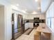 Updated kitchen with stainless steel appliances, white cabinets and a breakfast nook at 5630 Golf Pointe Dr # 206, Sarasota, FL 34243