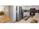 Stainless steel appliances in updated kitchen with white cabinets and tiled floor at 5630 Golf Pointe Dr # 206, Sarasota, FL 34243